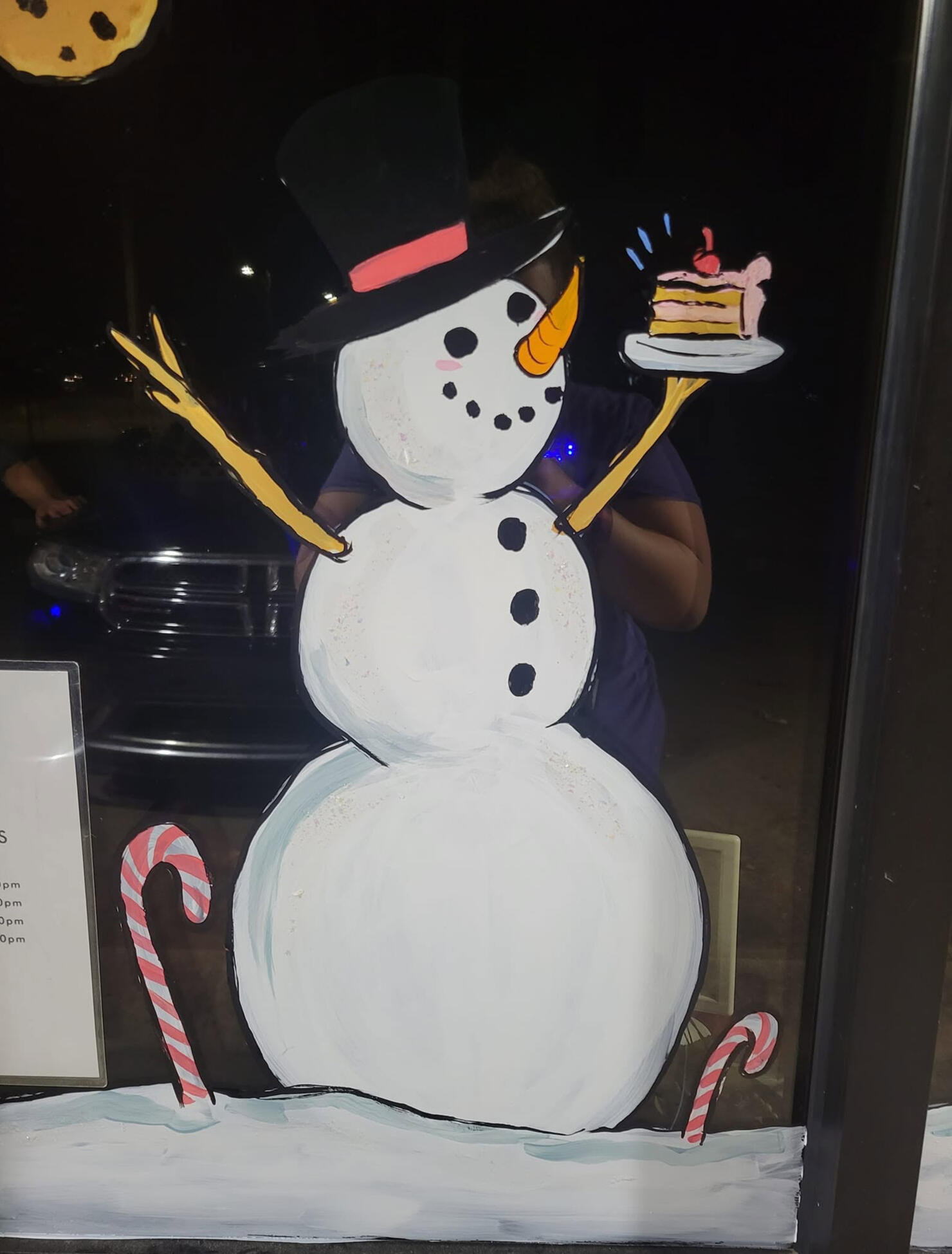 snowman eating cakes window painting