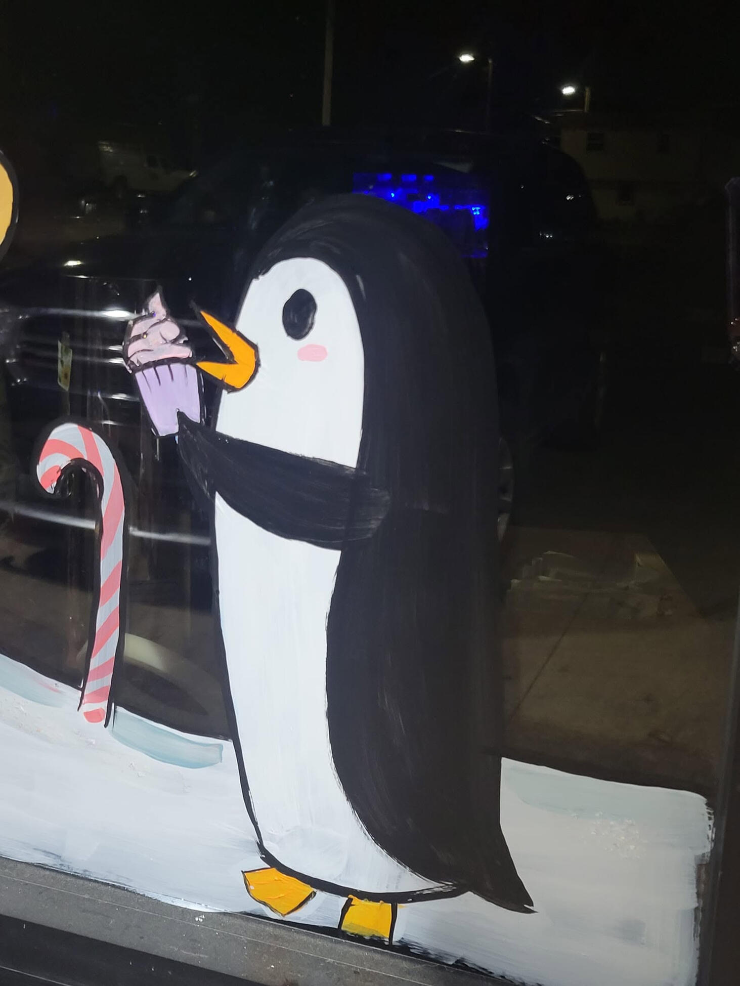 penguin eating a cupcake window painting